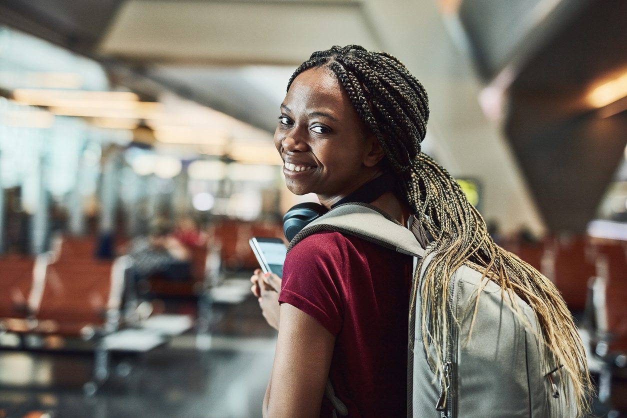 Cropped shot of a happy young woman at the airport